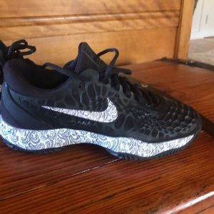 Nike court shoes.  Beautiful black color with printed logo and bottoms.  Size 9.